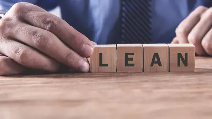 wooden blocks on a table forming in the word LEAN