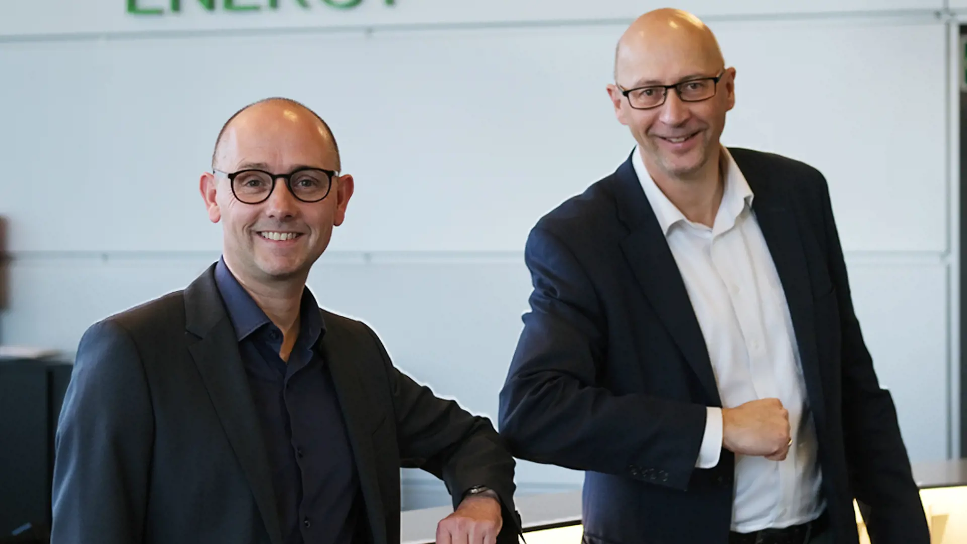 Image of Mads Bach Christiansen and Anders C. Anderson giving a corona elbow greeting